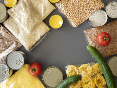 top-view-of-bunch-of-food-provisions-for-donation-with-copy-space